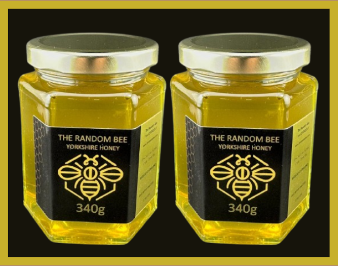 Two jars of Yorkshire honey from The Random Bee on a black background