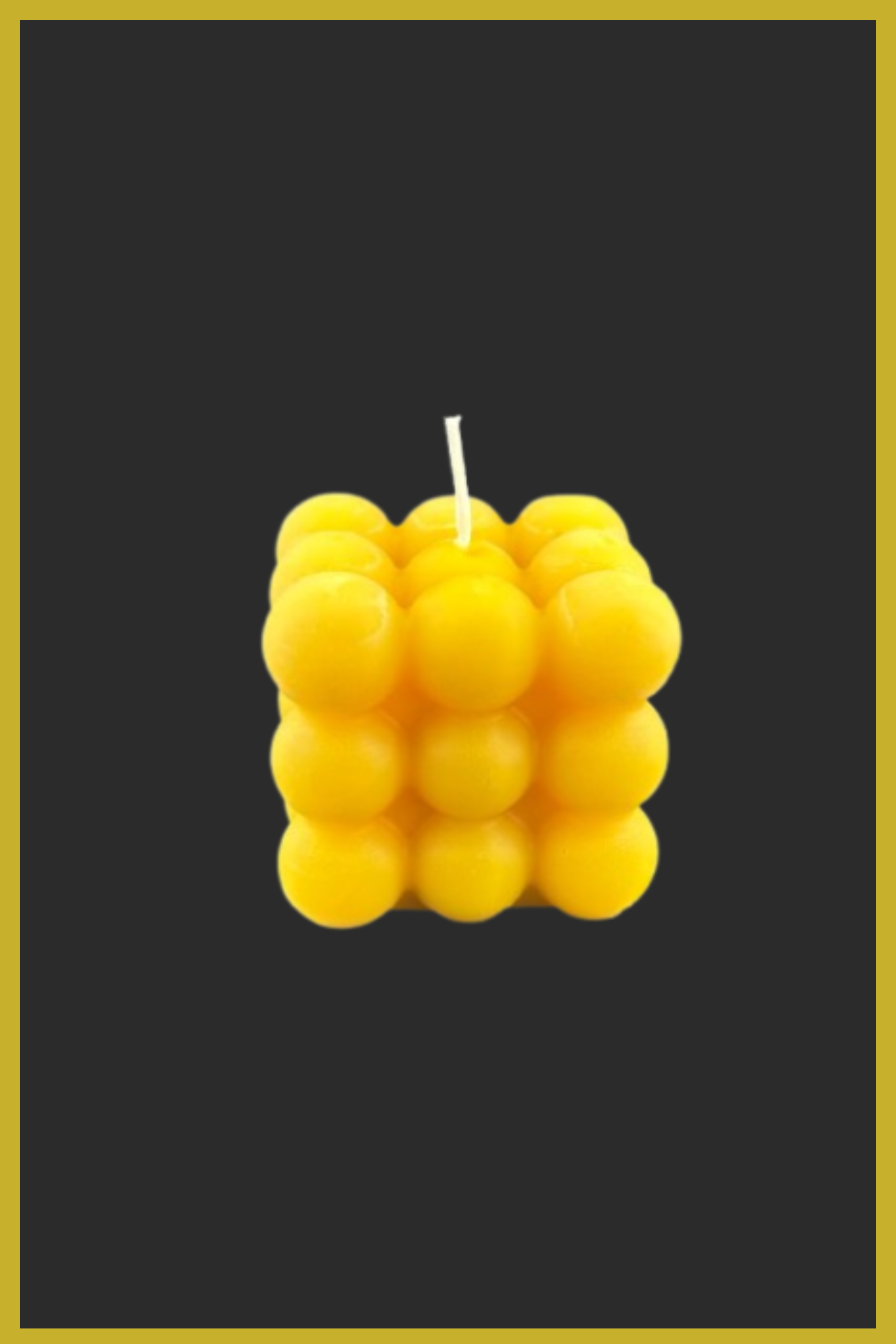 Yellow bubble candle on a black background